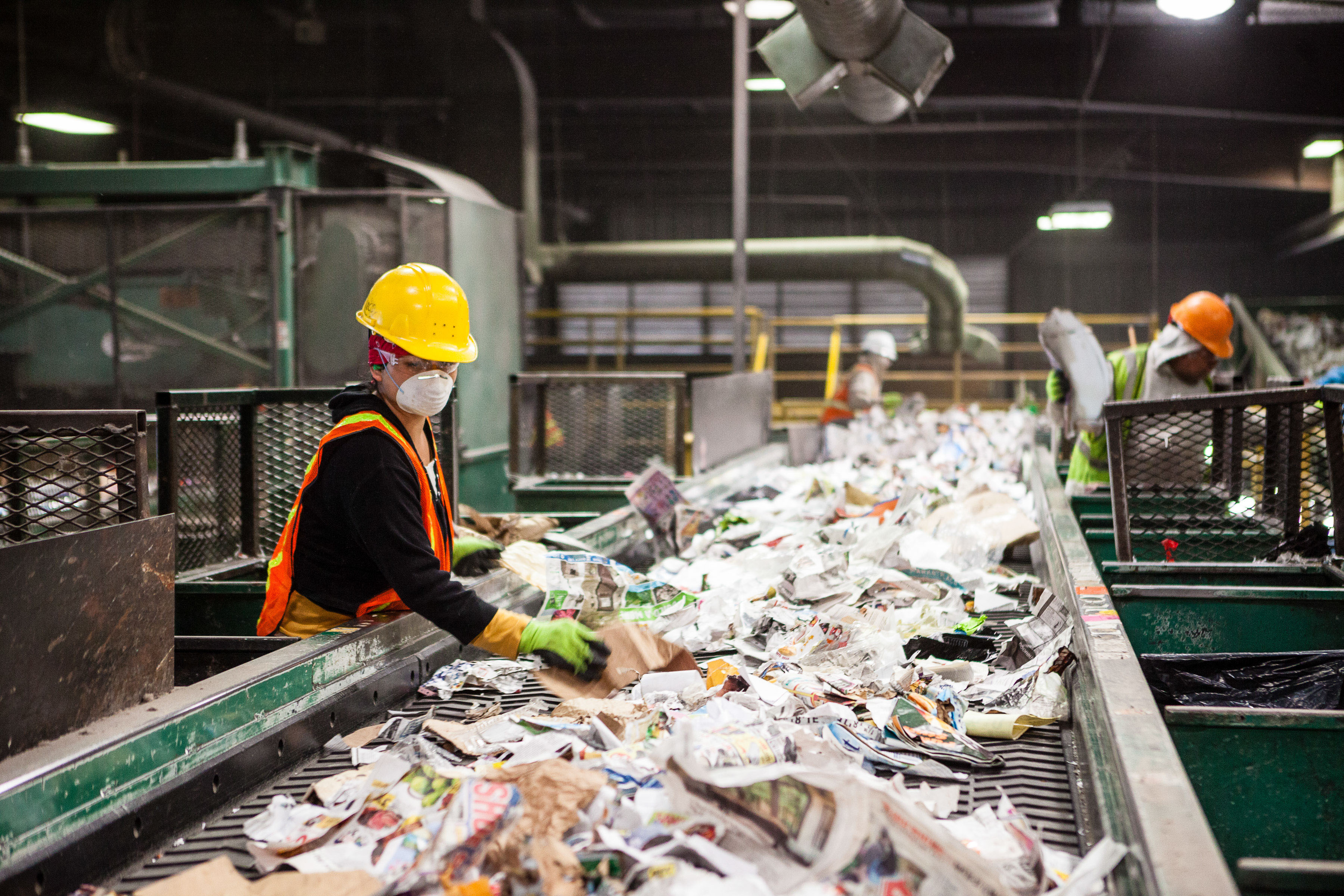Employees at Farwest Fibers at work sorting paper