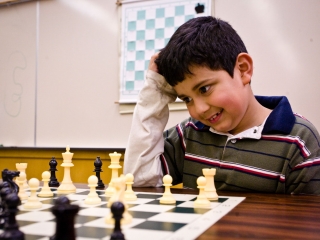 Brayan Moreno-Loa sits chess board scratching his head