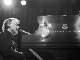 Bruce Hornsby at the piano singing on stag