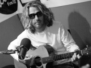 Collective Soul Vocalist Ed Roland plays in the studio of portland radio station.