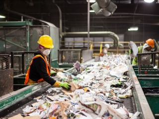 Employees at Farwest Fibers at work sorting paper