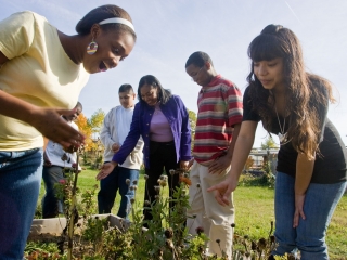 Humboldt Principal Jamila Williams with Students in garden