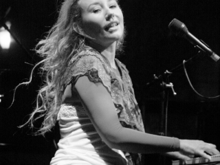 Tori Amos sings and plays piano at a concert in Portland Oregon.