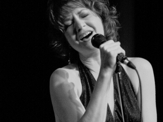 Valerie Day sings with eyes closed.