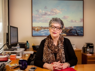 Businesswoman in her Office sitting at her desk
